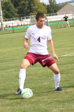 Bryan White ‘14 controls the ball. 