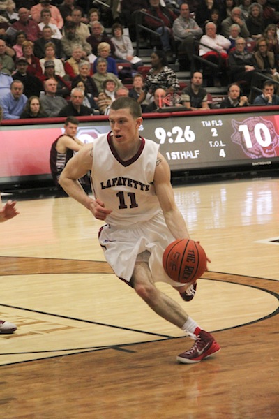 Sophomore Nick Linder dribbles into the paint for a lay-up.[Photo by Christie Behot ‘16]