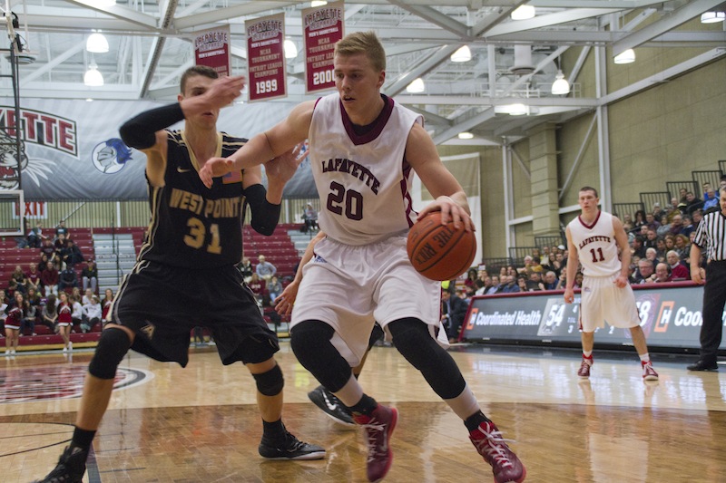 Senior center Dan Trist posts up the Army center en route to 24 points on Senior Day. [Photo by Hana Isihara ‘17]