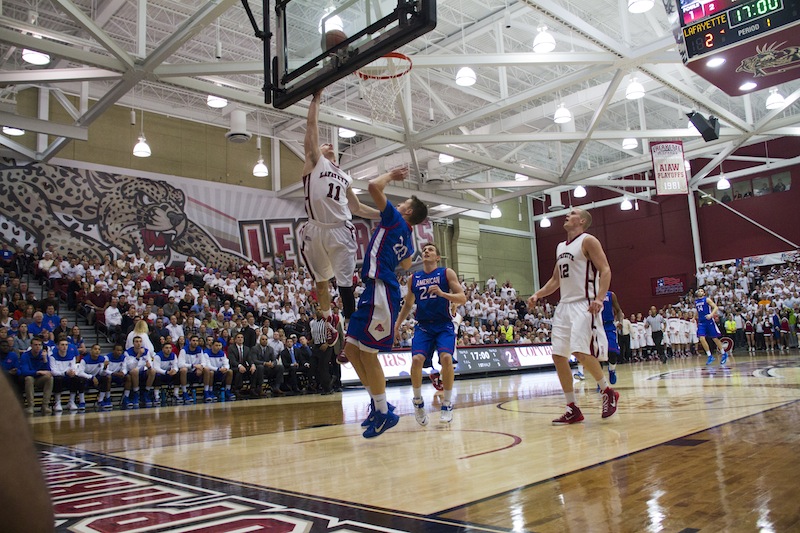 Nick Lindner drives to the basket for a layup against American. [Photo by Hana Isihara ‘17]